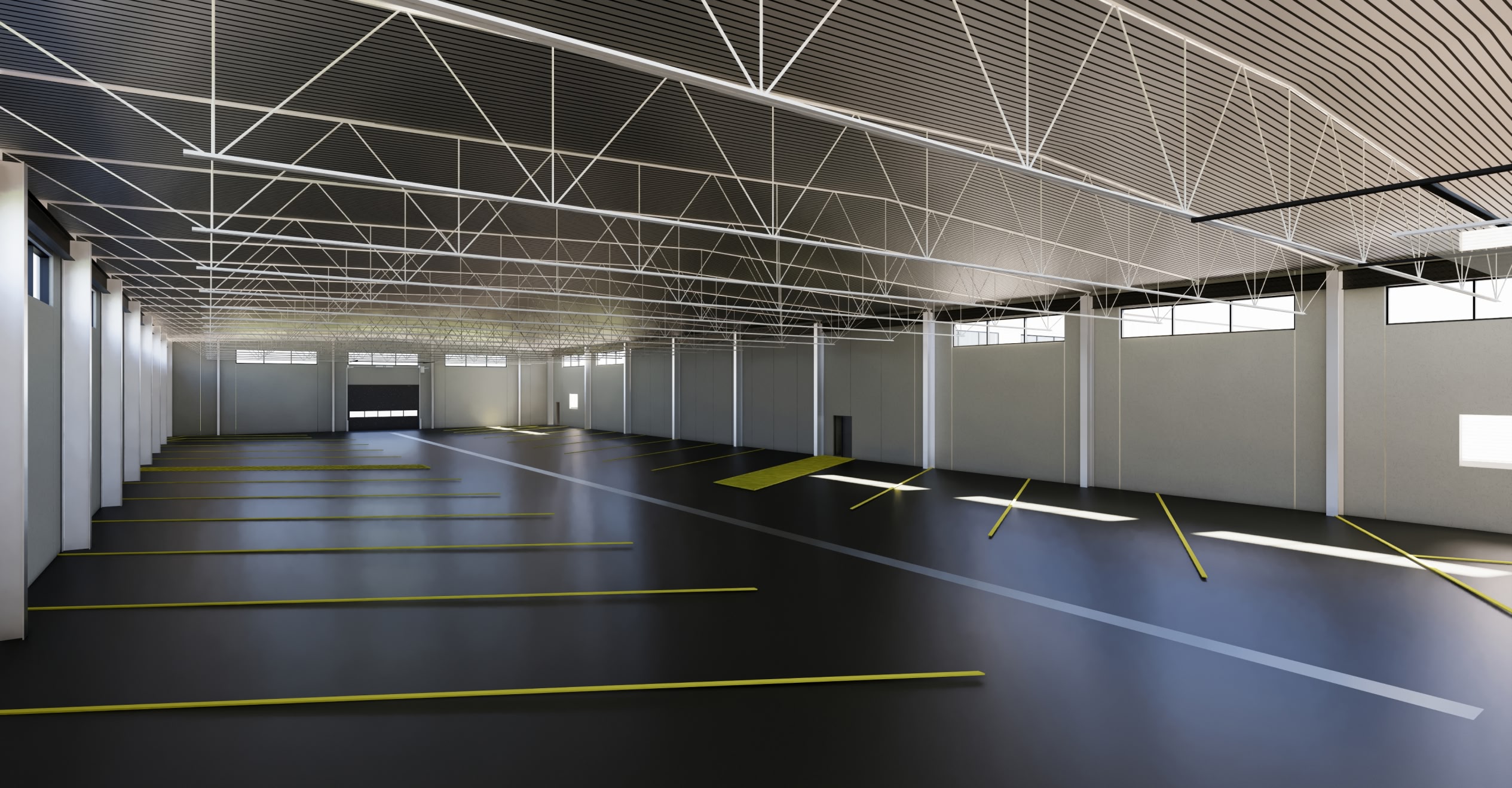 Spacious empty warehouse with dark flooring and high ceilings. Yellow lines mark parking spaces, while sunlight streams through high windows.