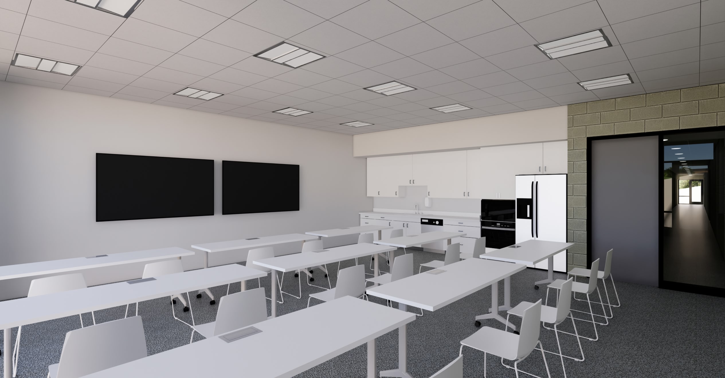 A modern classroom with white desks and chairs arranged in rows, two blackboards on the wall, and a kitchenette with cabinets.