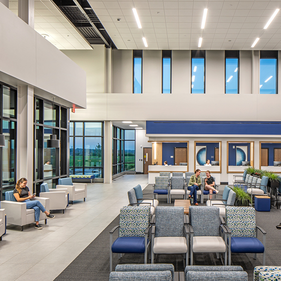 Patient waiting area inside the MD West One Fountain Ridge clinic featuring seating clusters, natural light, and views to adjacent clinical spaces.