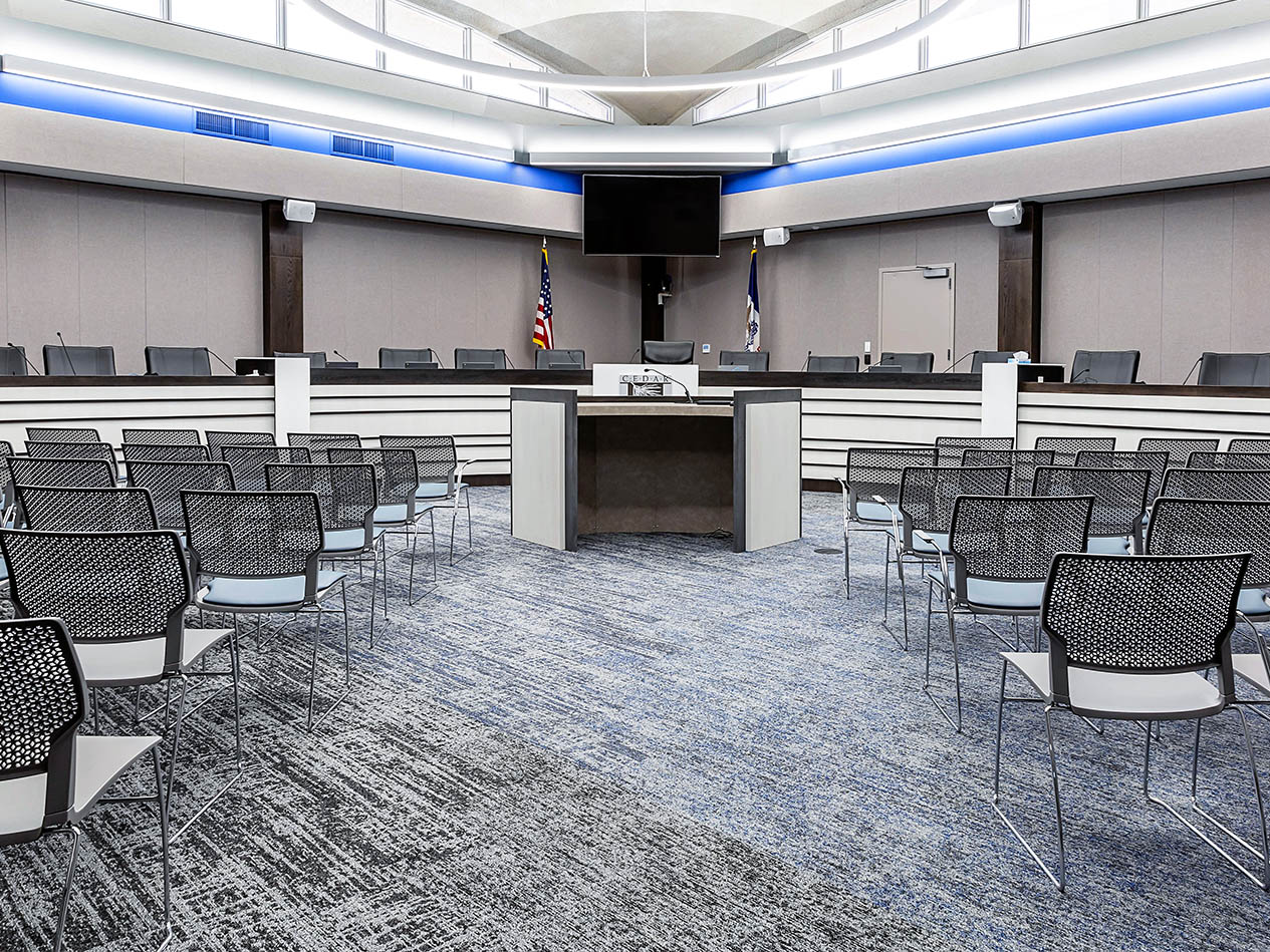 Seating area inside Cedar Falls City Hall designed for council meetings and community gatherings.