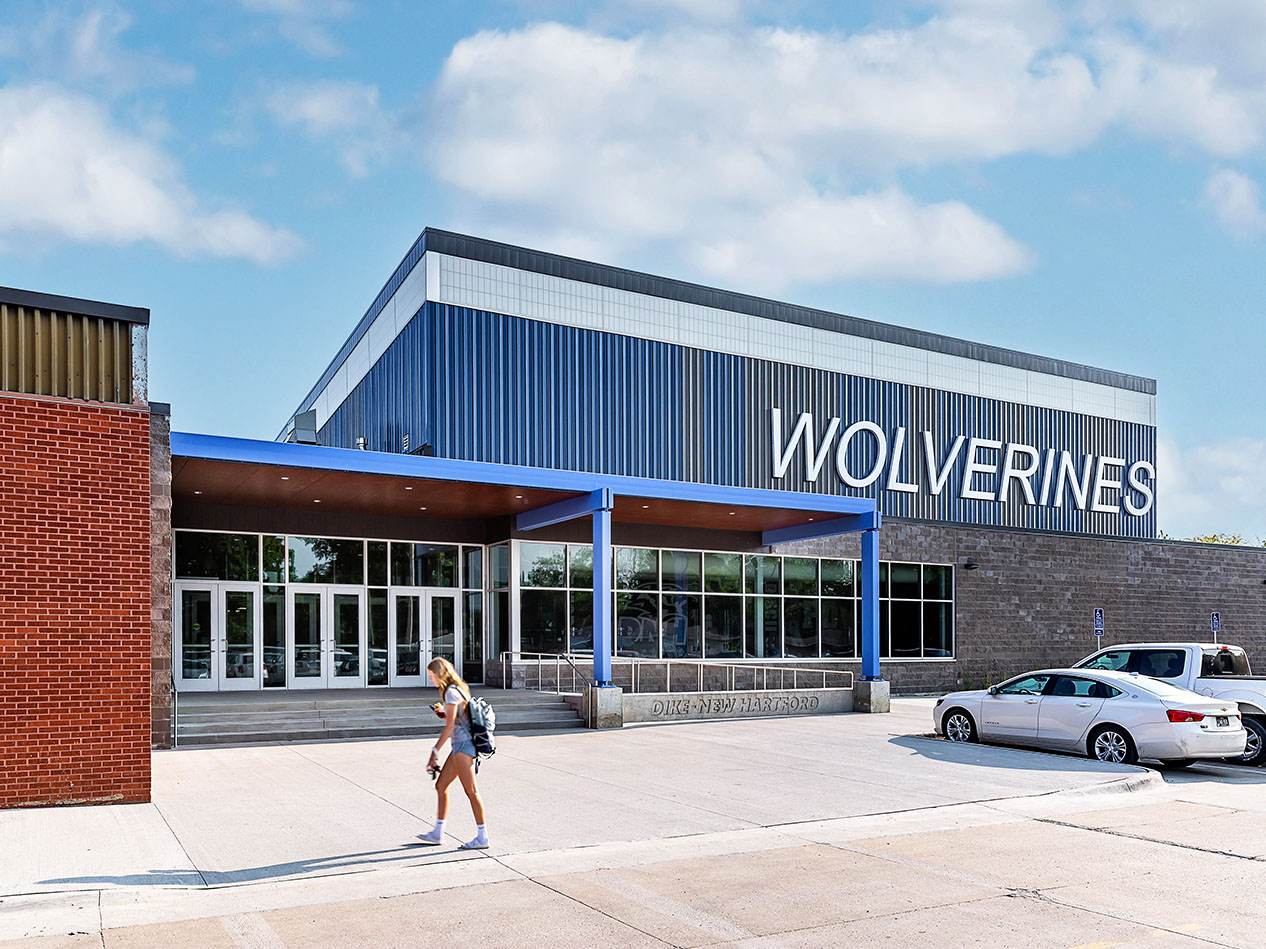 Dike-New Hartford school exterior with “Wolverines” signage and covered entry.