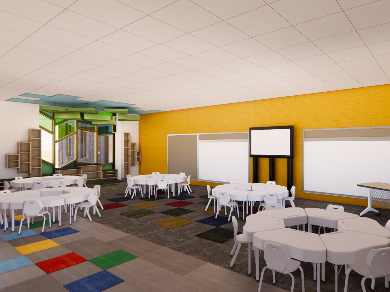 Kindergarten classroom with round tables, flexible seating, colorful flooring, and integrated display boards in Decorah Community School District elementary school.