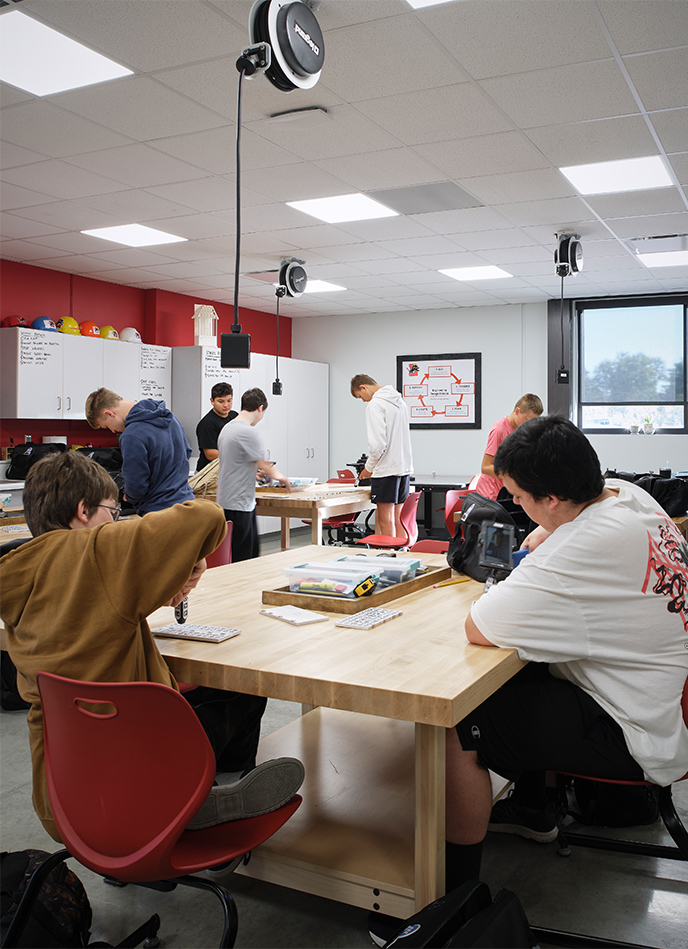 Flexible CTE classroom environment with students working on projects.