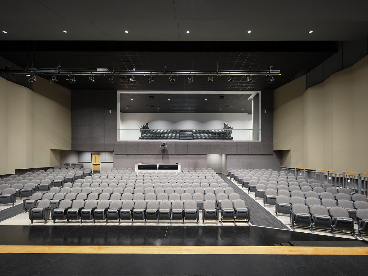 Performance-ready auditorium stage supporting music, theater, and student activities.