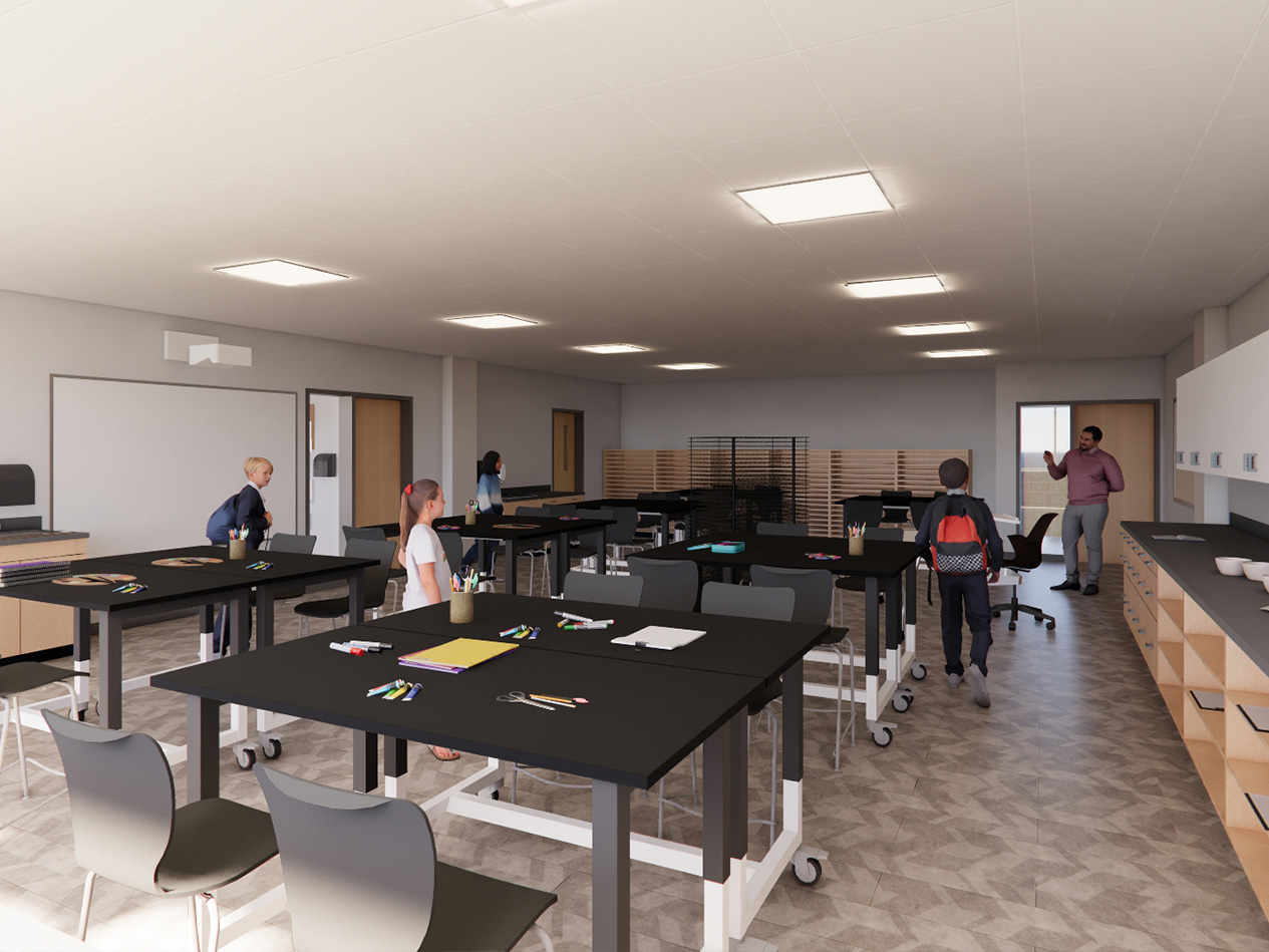 Middle school art classroom with movable work tables, student seating, and integrated storage.