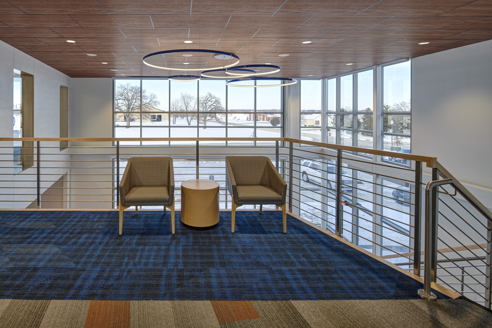 Waiting area with lounge seating and exterior views.