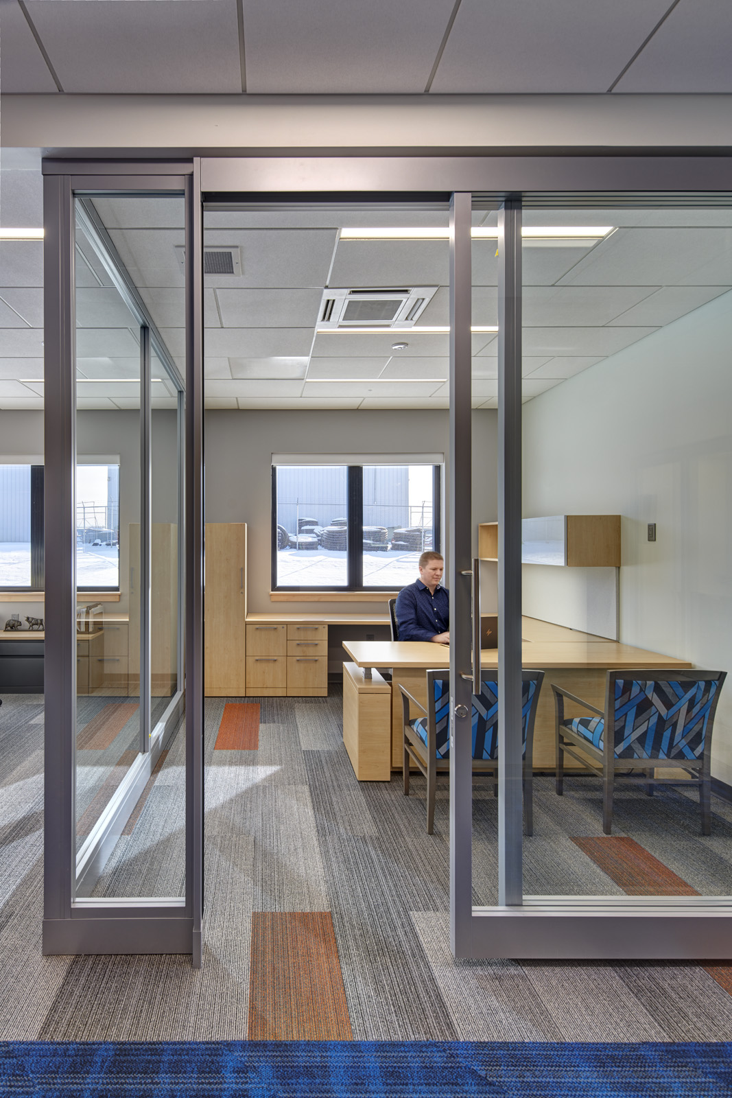 Private office designed for focused work within a collaborative environment.