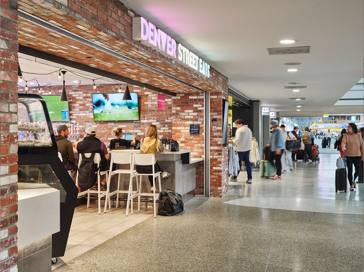 Denver Street Eats full-service bar and dining area along the airport concourse